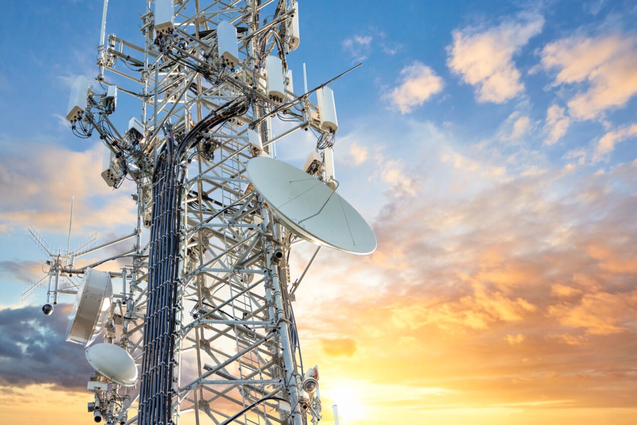 5G Sunset Cell Tower: Cellular communications tower for mobile phone and video data transmission